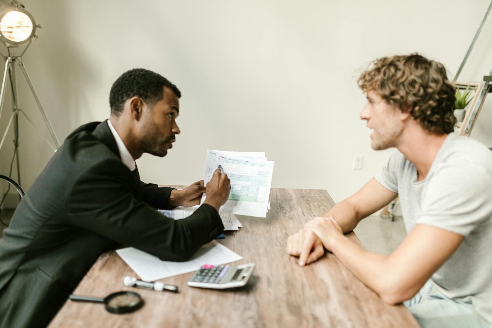 Financial advisor reviewing documents with a client